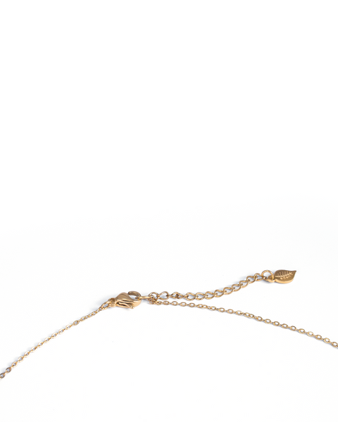 Close-up of a delicate gold chain necklace with an adjustable lobster clasp and a small leaf-shaped charm, photographed on a clean white background.