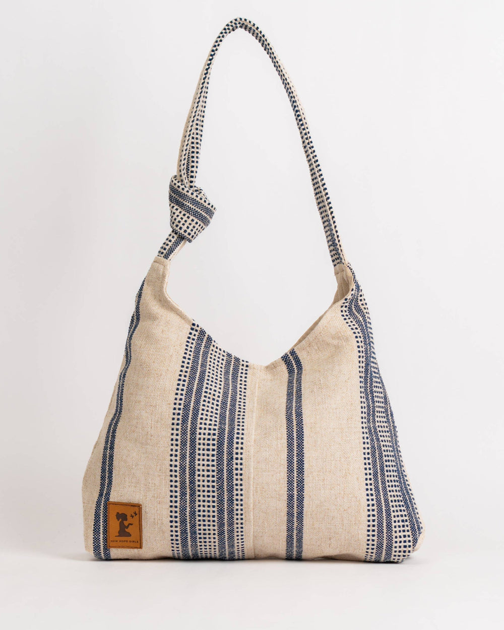 Textured handbag with a strap on a white background