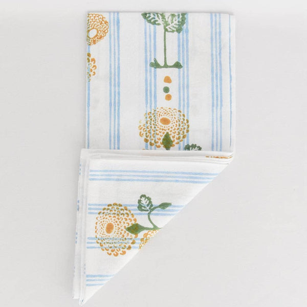 Two folded towels with floral patterns on a light gray background