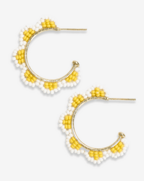 Pair of yellow and white beaded hoop earrings on a white background
