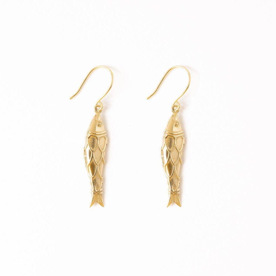 Gold fish-shaped earrings on a white background