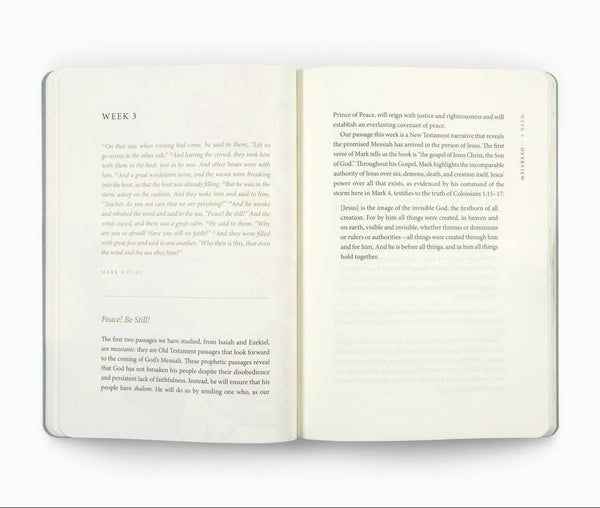 An open book with two cream-colored pages displaying printed text, photographed against a solid white background.