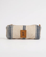 Fabric pouch with striped pattern and brand logo on a white background