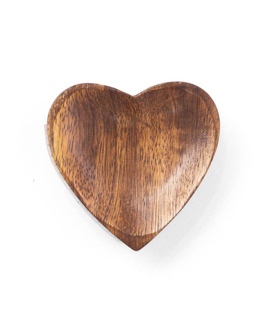 Wooden heart-shaped object on a white background