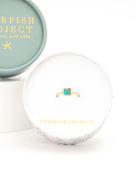 Starfish Project jewelry box with a ring inside on a white background