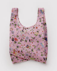 Floral-patterned reusable bag on a white background
