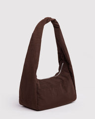 Brown shoulder bag on a light gray background