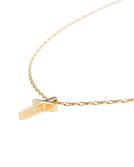 Gold necklace with a unique pendant on a white background