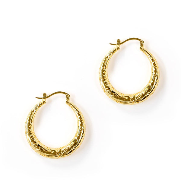 Gold hoop earrings on a white background