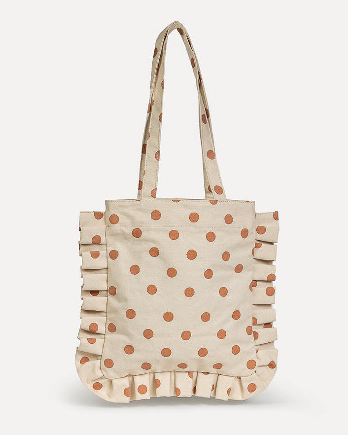 Beige tote bag with brown polka dots on a white background