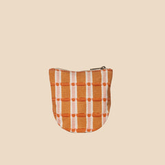 Small pouch with orange and white checkered pattern on a white background by JOYN a fair trade company