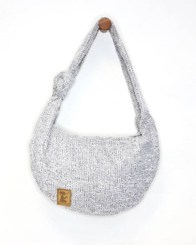 This bag has a full zipper closure across the top. The strap is fixed wi...