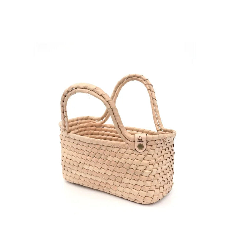 Woven basket with handles on a white background