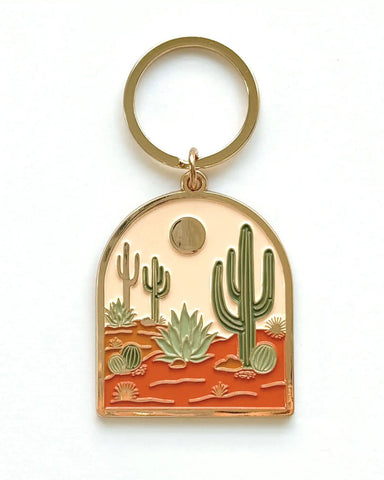 Our desert-inspired keychain turns original hand-illustrations into a be...