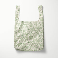 Reusable bag with green leaf pattern on a white background