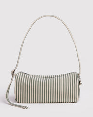 Striped handbag with a strap on a light gray background