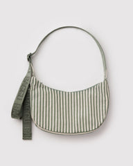 Green and white striped handbag with a strap on a light gray background