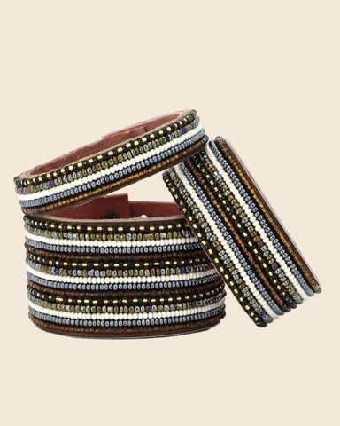 The Stripes Neutral Beaded Leather Cuff is the perfect fair trade bracel...