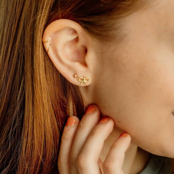 gold bow nap earrings