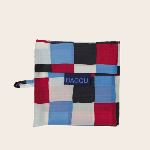 Colorful checkered pouch with 'BAGGU' logo on a beige background