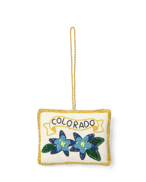 Decorative ornament with 'Colorado' text and floral design on a white background