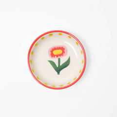 Small ceramic plate with a floral design on a white background