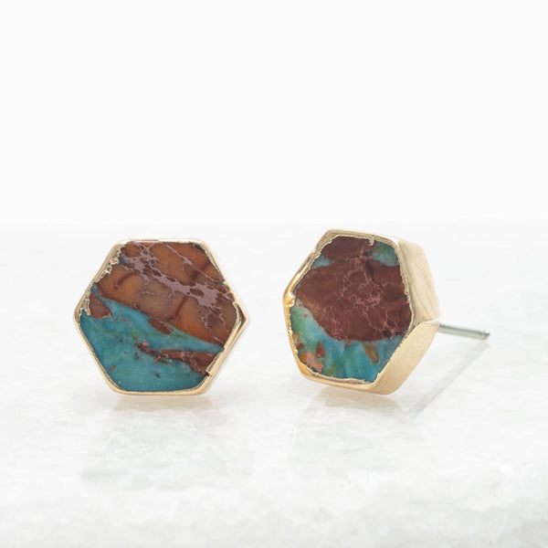 Hexagonal earrings with turquoise and brown stone inlays on a white background