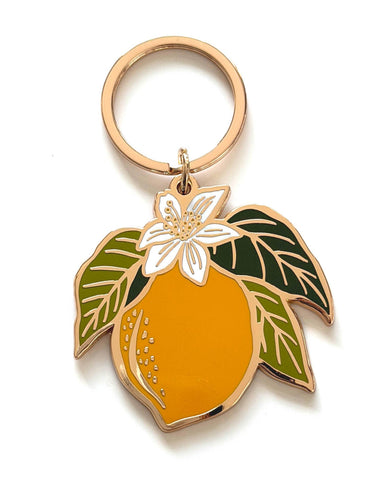 Our Lemon Blossom Gold Plated Keychain turns original hand-illustrations...
