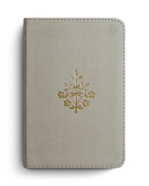 Light gray leather notebook with gold embossed design on a white background