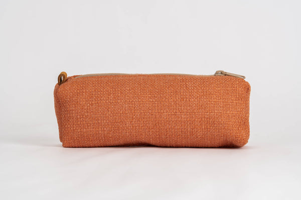 A rectangular zippered pouch in a textured rust-orange fabric, shown against a plain white background.