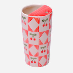 Tumbler with geometric pattern and cherry design on a white background