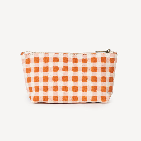 Checkered pouch with orange and white pattern on a white background