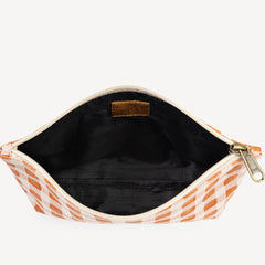 Open pouch with orange geometric pattern on a white background
