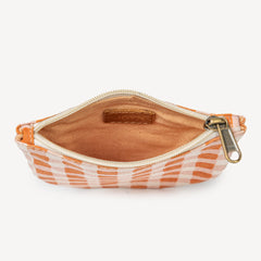 fair trade pouch with orange and white pattern on a white background