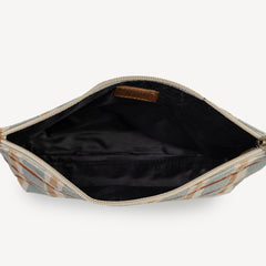 Open beige and brown patterned pouch with black interior on a white background