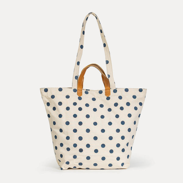 Tote bag with blue polka dots on a white background