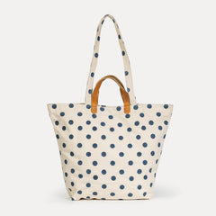 Tote bag with blue polka dots on a white background
