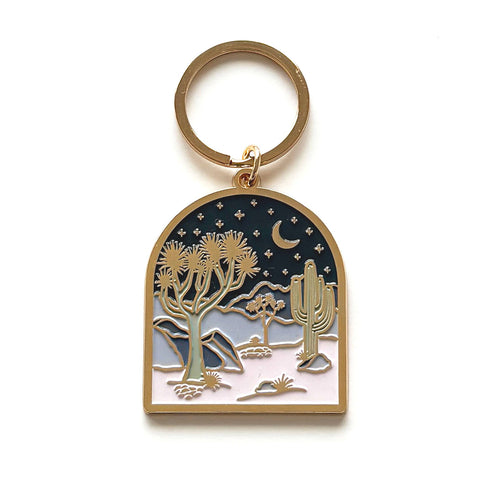 The Cool Desert Arch Gold Keychain is the perfect companion for the gree...