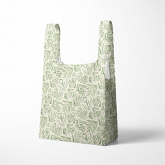Reusable shopping bag with green leaf pattern on a white background