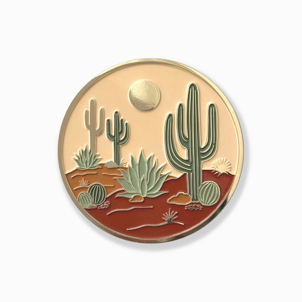Desert landscape coin with cacti and a sun on a white background
