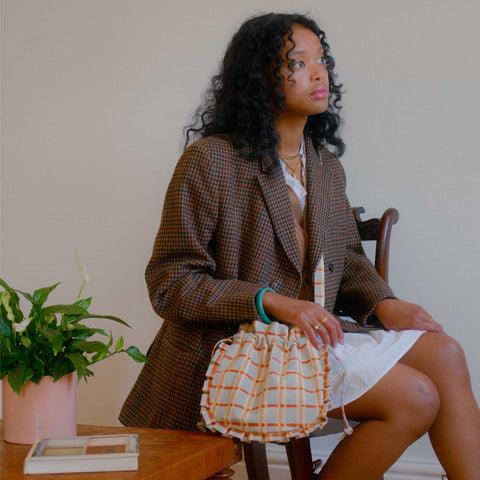 
Meet the Momo Crossbody, the cutest fair trade ruffle drawstring purse....
