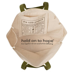 Beige tote bag with green straps and 'hold on to hope' text on a white background