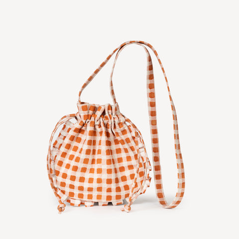 
Meet the Momo Crossbody, the cutest fair trade ruffle drawstring purse....