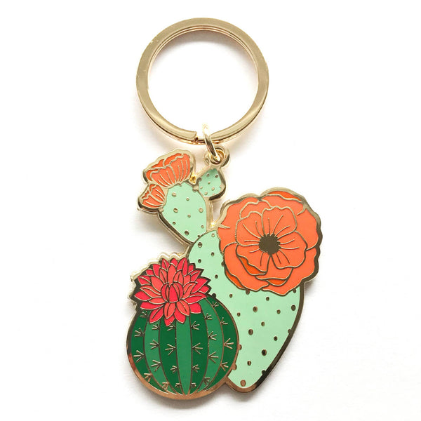 Colorful cactus-shaped keychain with flowers on a white background