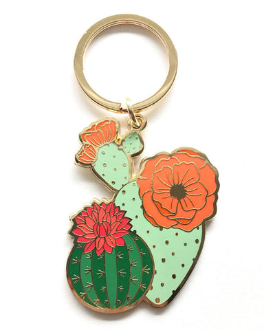 Our Blooming Cacti Gold Plated Keychain turns original hand-illustration...