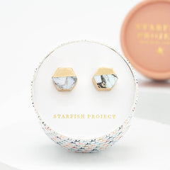 Marble stud earrings in a 'Starfish Project' jewelry box on a white background