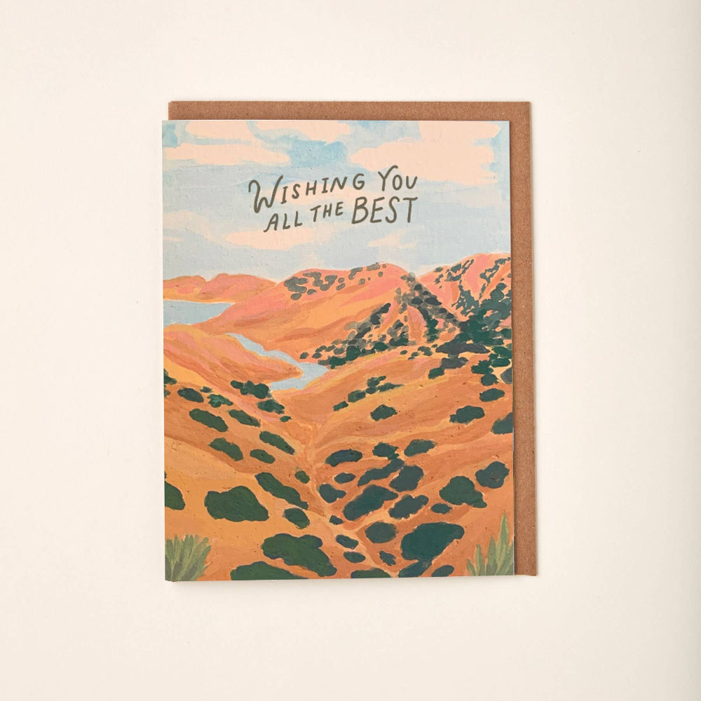 Greeting card with desert landscape illustration and 'Wishing You All the Best' text on a beige background